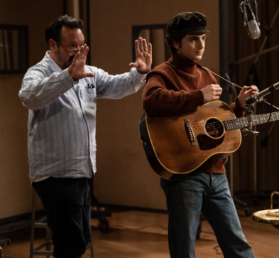 Director James Mangold and Timothée Chalamet on the set of A Complete Unknown. 